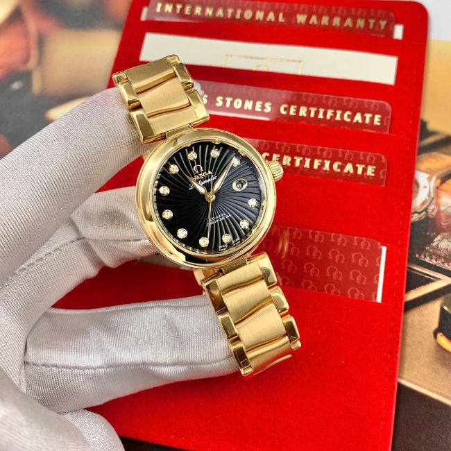 Omega De Ville 425.65.34.20.51.001 Ladymatic mặt số đen cọc hạt vàng khối 18k 34mm 1 Omega De Ville 425.65.34.20.51.001 Ladymatic mặt số đen cọc hạt vàng khối 18k 34mm 1